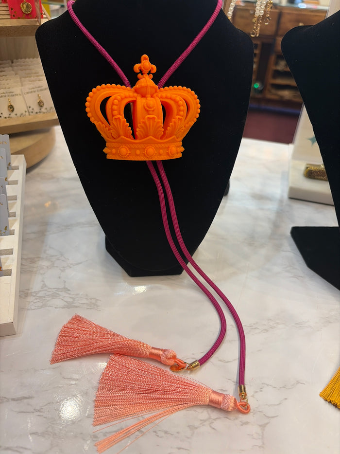 Rahya Jewelry Design bolo tie necklace featuring a decorative cord with a polished metal slide and intricate design details.