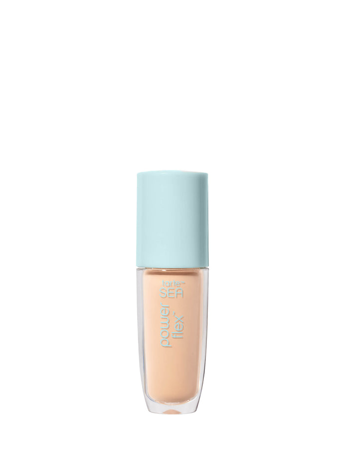 Foundation bottle with light blue cap on a white background