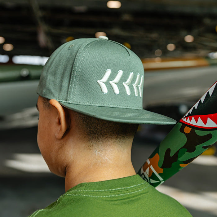 Olive green snapback hat with white embroidered baseball seam stitch design
