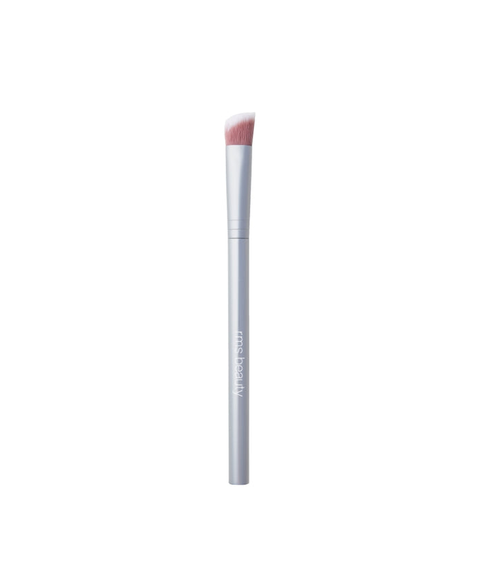 Skin2Skin Concealer Brush with soft angled bristles and sleek silver handle designed for precise application of makeup, featuring clean beauty and sustainable packaging elements.