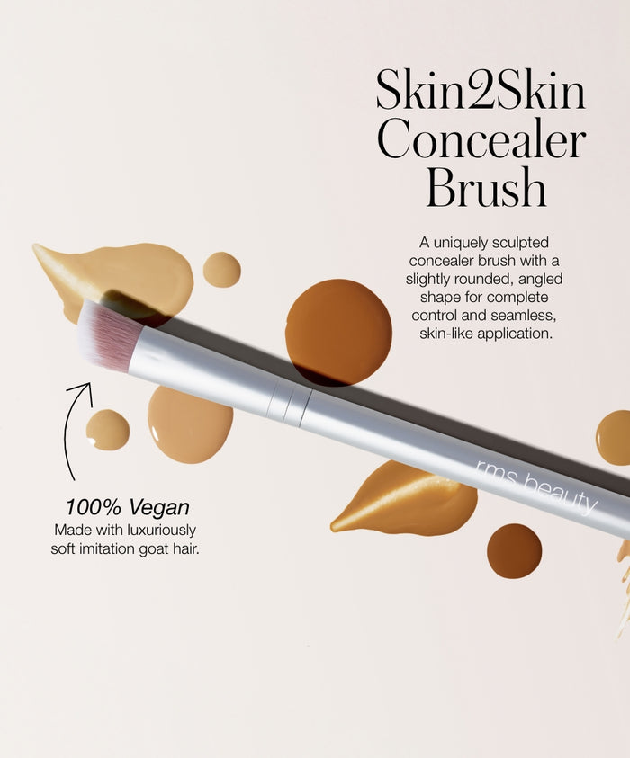 Skin2Skin Concealer Brush with soft, vegan imitation goat hair bristles, designed for seamless, skin-like application and precise control with a rounded, angled shape.