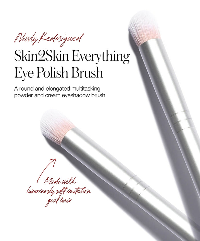 Close-up image of two Skin2Skin Everything Eye Polish Brushes with soft, rounded bristles and sleek metallic handles, designed for applying powder and cream eyeshadow.