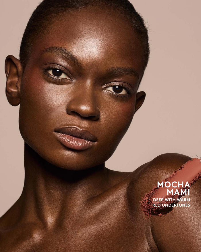 Deep skin tone model wearing sun stalk'r bronzer in shade Mocha Mami.