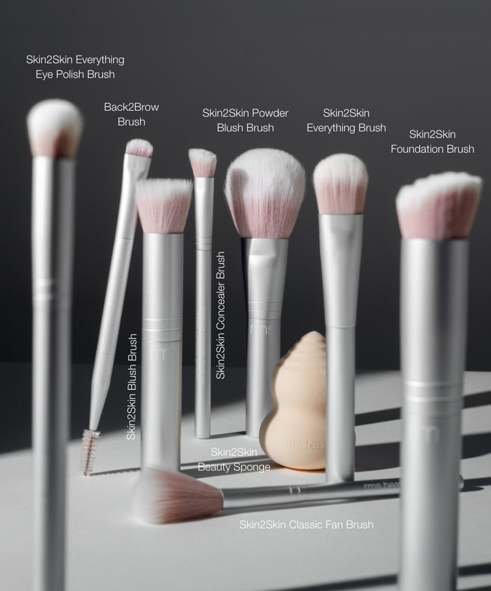 The Artist Toolkit featuring a set of soft-bristle makeup brushes and a beauty sponge, designed for precise application and blending with clean, cruelty-free ingredients.
