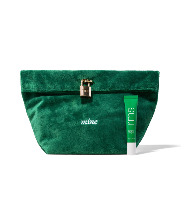 The Chameleon 2-Piece Set featuring a plush green velvet pouch with a gold-toned lock and an rms beauty green tube of clean, cruelty-free makeup with natural ingredients.