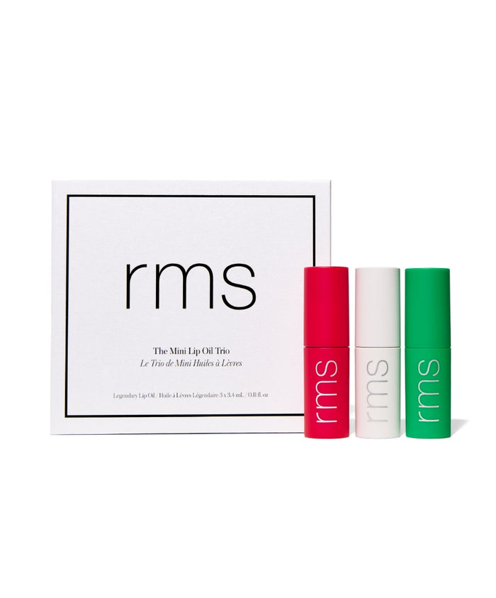 The Mini Lip Oil Trio by RMS Beauty featuring three vibrant lip oils in red, white, and green packaging, highlighting clean beauty with natural and cruelty-free ingredients.