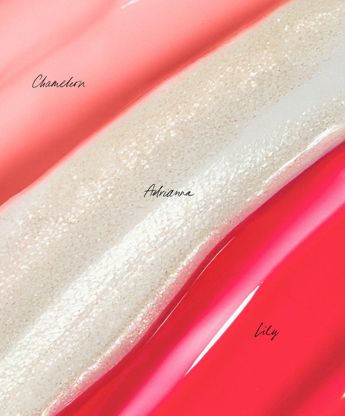 Close-up of three lip gloss swatches labeled Chameleon, Adrianna, and Lily, showcasing the colors and textures from The Mini Lip Oil Trio in a smooth glossy finish.