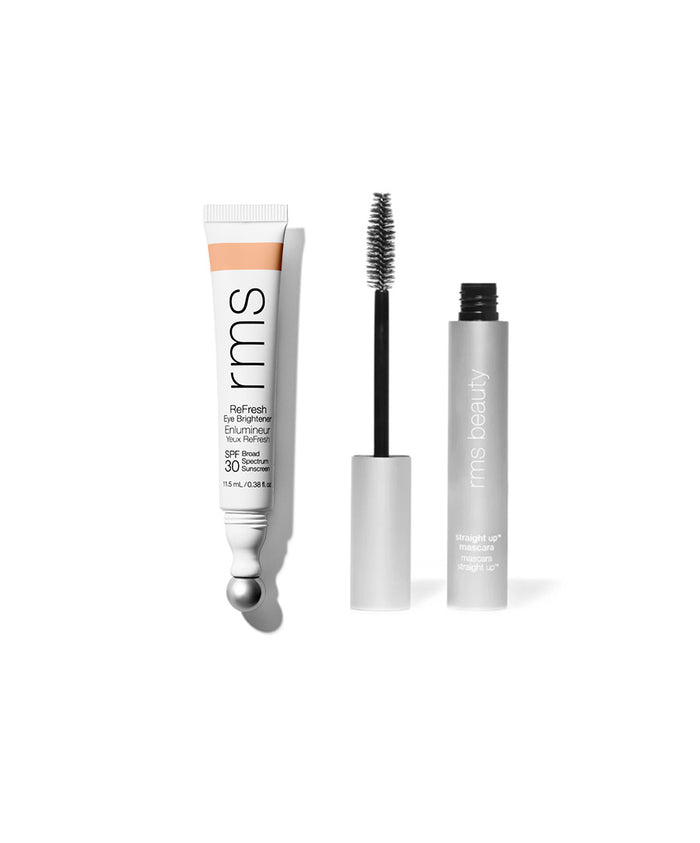 The Wide Awake Duo featuring a sleek white tube of RMS Beauty eye brightener with SPF 30 and a silver mascara tube with its wand, both showcasing clean beauty and natural ingredients.