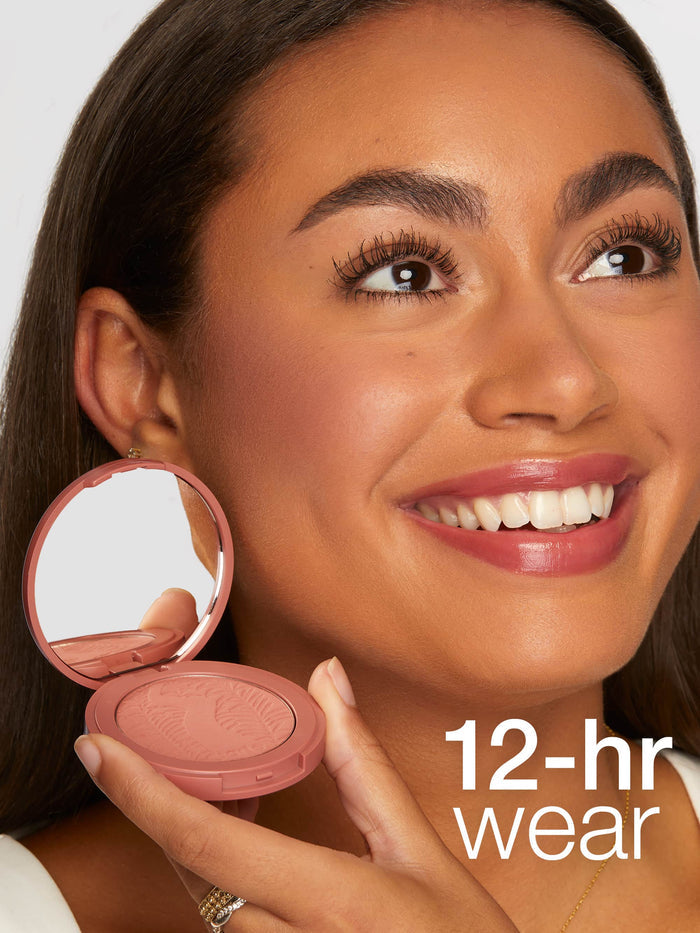 Woman holding a compact blush with '12-hour wear' text