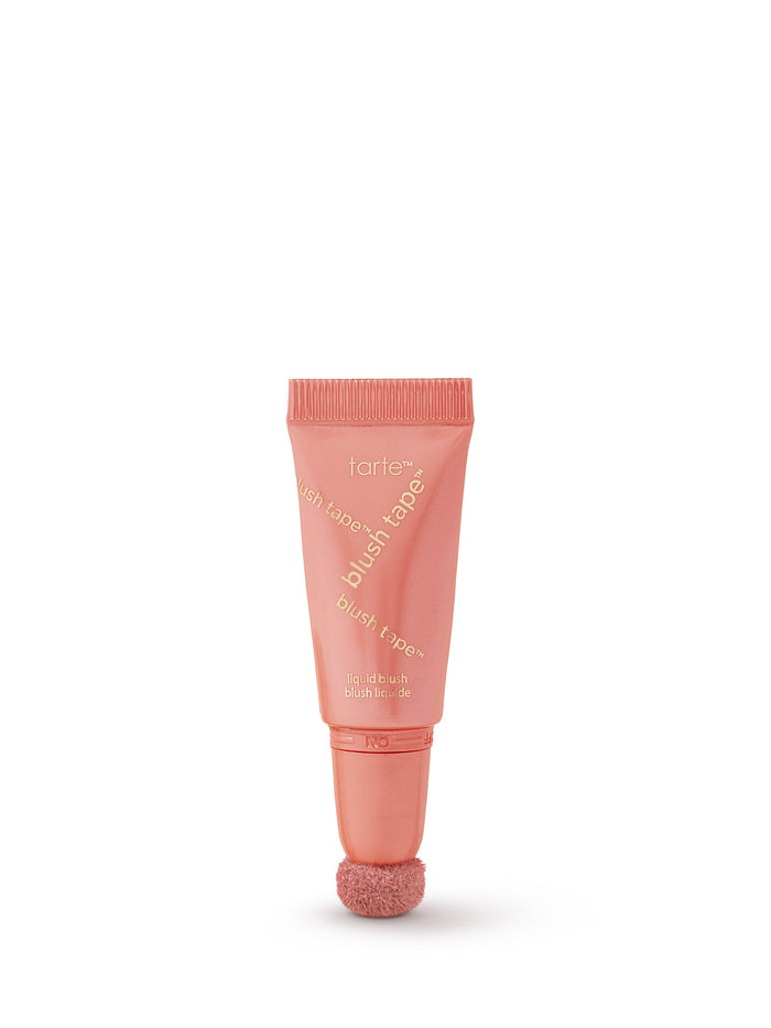Pink lip balm tube on a white background