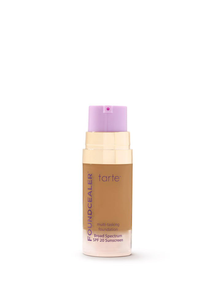 Tarte multi-benefit foundation bottle with purple cap on a white background