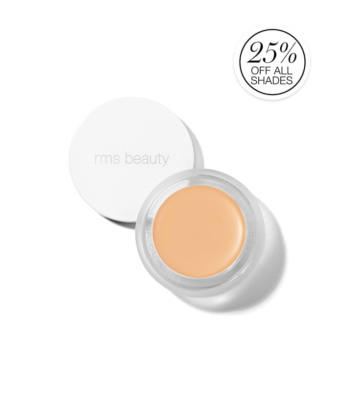 Open jar of UnCoverup Concealer showing smooth, creamy beige shade with white lid embossed rms beauty, promoting clean beauty and cruelty free makeup.