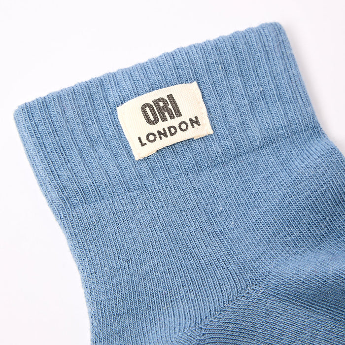 Men's airforce blue ankle socks with ORI LONDON logo patch at the cuff.