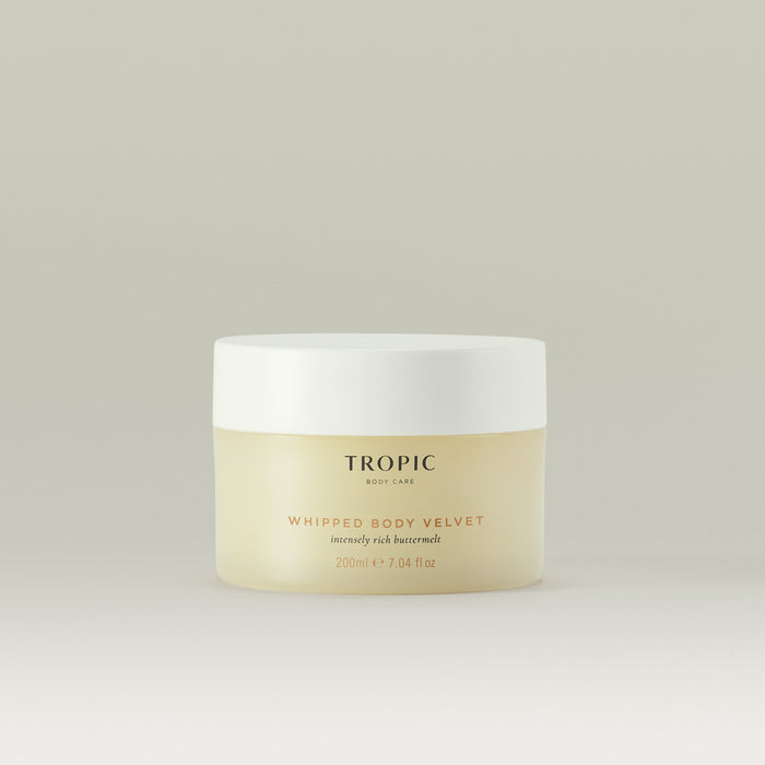 Tropic Whipped Body Velvet body butter in a cream jar with a white lid against a neutral background.