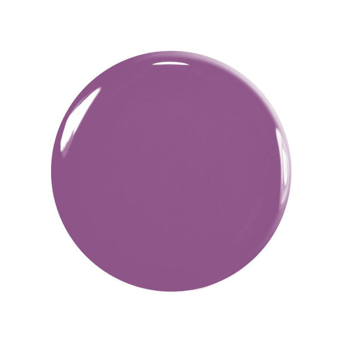 A smooth, glossy, circular splash of purple paint—evoking the Manucurist You  Me at a Tea Party Green Flash™ Set—on a white background highlighted by light reflections.